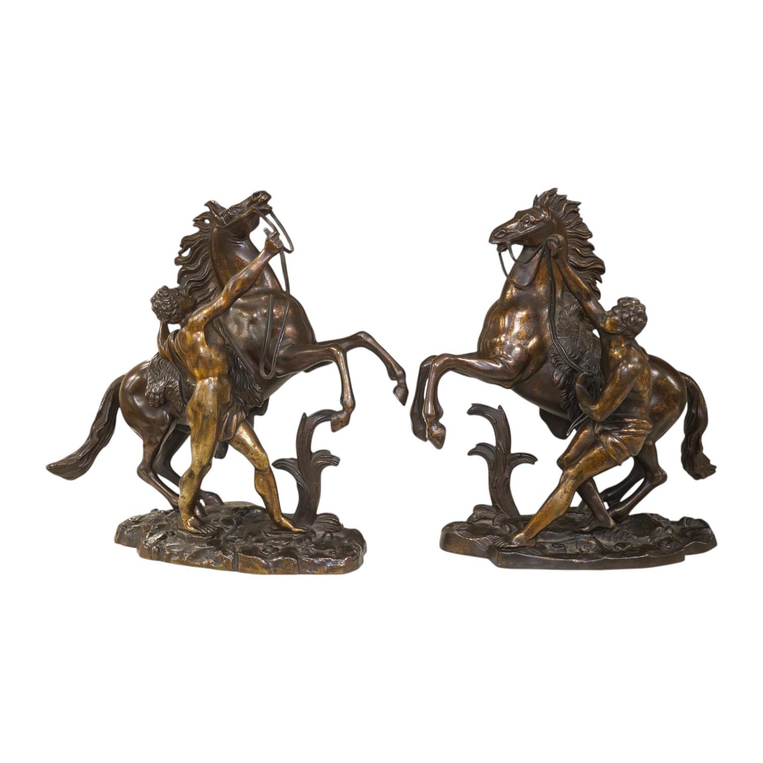 After Guillaume Coustou, a pair of dark patinated bronzes, The Marly Horses, 19th century, 25.5cm high. Condition - good.